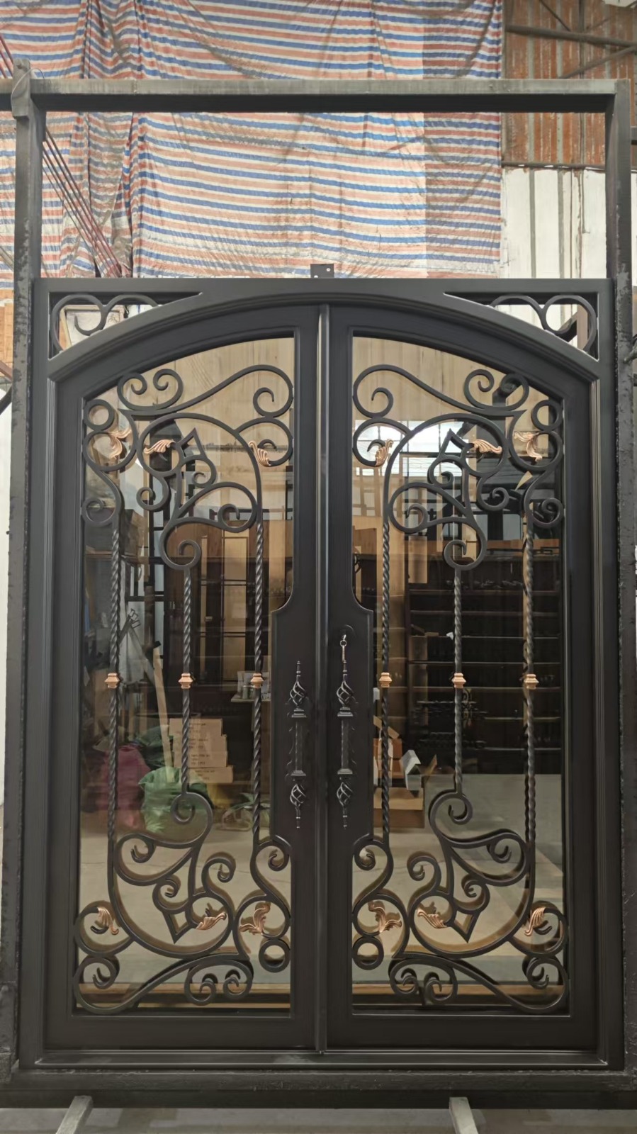 Ornate black wrought iron entry door